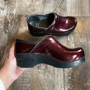 Dansko patent leather clogs